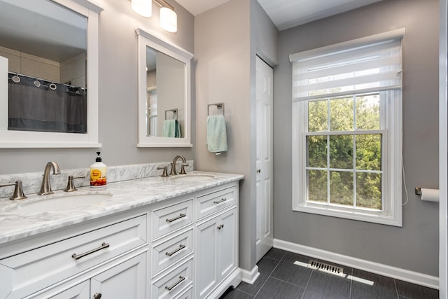 923 Christa Ct, Elk Grove Village, IL 60007 - bathroom with double vanity, tile patterned floors, and curtained shower