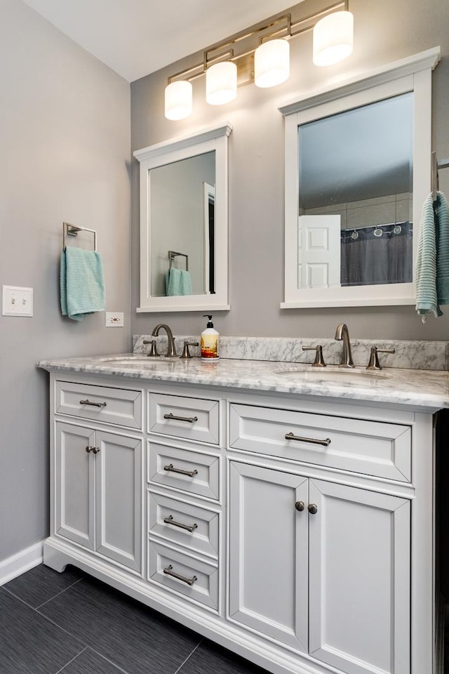923 Christa Ct, Elk Grove Village, IL 60007 - bathroom with double vanity, tile patterned floors, and curtained shower