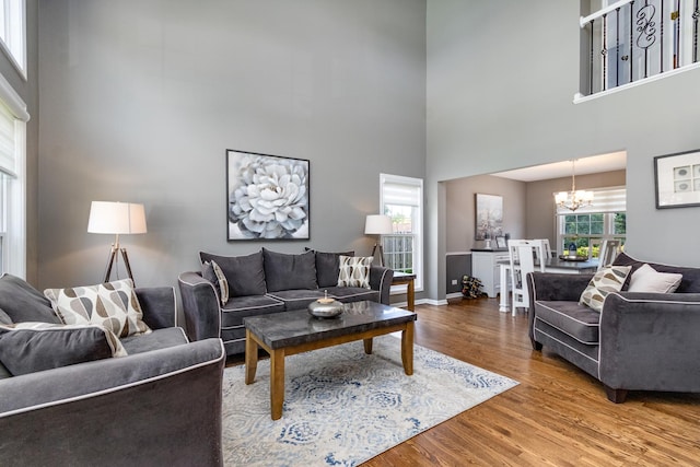 923 Christa Ct, Elk Grove Village, IL 60007 - living area featuring a high ceiling, a chandelier, and wood finished floors