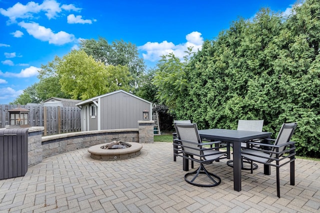 923 Christa Ct, Elk Grove Village, IL 60007 - view of patio / terrace featuring outdoor dining space, a fire pit, and an outdoor structure