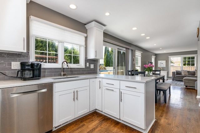 923 Christa Ct, Elk Grove Village, IL 60007 - kitchen with stainless steel dishwasher, a peninsula, recessed lighting, light countertops, and white cabinetry