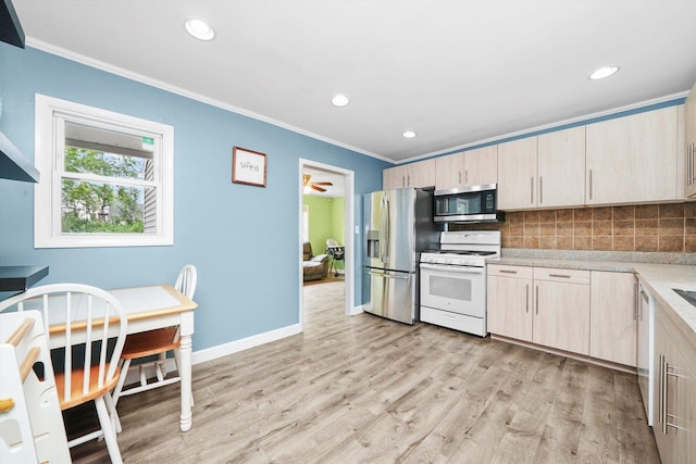 9111 Memory Trl, Wonder Lake, IL 60097 - kitchen with stainless steel appliances, light countertops, crown molding, tasteful backsplash, and light wood finished floors