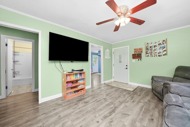 9111 Memory Trl, Wonder Lake, IL 60097 - living area with crown molding, a ceiling fan, and light wood finished floors