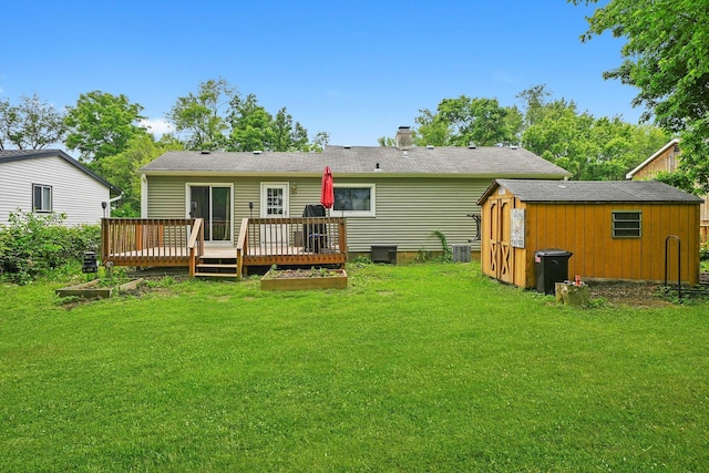 9111 Memory Trl, Wonder Lake, IL 60097 - back of house featuring a storage unit, a yard, a wooden deck, and a chimney