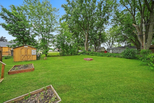 9111 Memory Trl, Wonder Lake, IL 60097 - view of yard with a storage unit and a vegetable garden