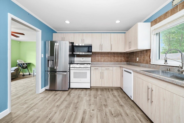 9111 Memory Trl, Wonder Lake, IL 60097 - kitchen featuring appliances with stainless steel finishes, tasteful backsplash, light wood finished floors, light countertops, and light brown cabinets