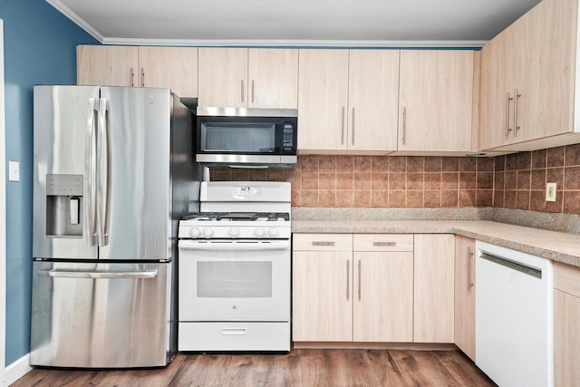 9111 Memory Trl, Wonder Lake, IL 60097 - kitchen with stainless steel appliances, light brown cabinetry, light countertops, decorative backsplash, and dark wood-type flooring