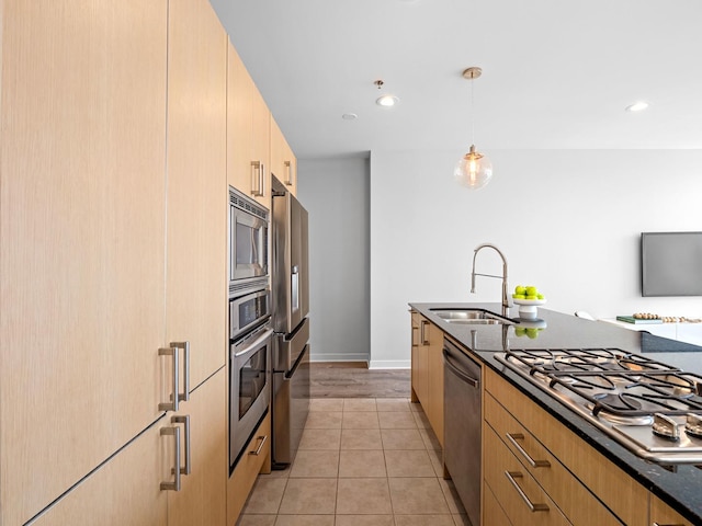 653 N Kingsbury St Unit 1707, Chicago, IL 60654 - kitchen featuring stainless steel appliances, dark stone counters, light brown cabinets, hanging light fixtures, and modern cabinets