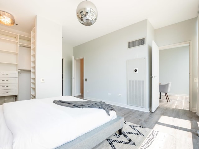 653 N Kingsbury St Unit 1707, Chicago, IL 60654 - bedroom featuring light wood-style floors and a spacious closet