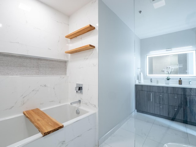 653 N Kingsbury St Unit 1707, Chicago, IL 60654 - full bath featuring a tub with marble appearance, double vanity, and marble finish flooring