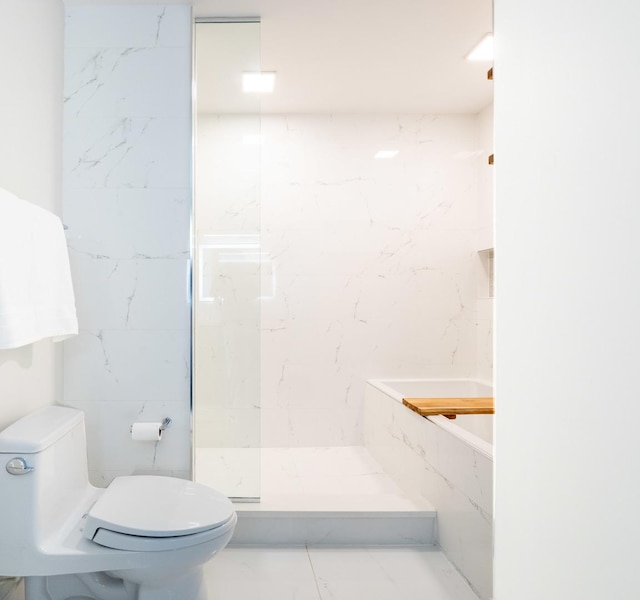653 N Kingsbury St Unit 1707, Chicago, IL 60654 - bathroom featuring walk in shower and marble look tiles