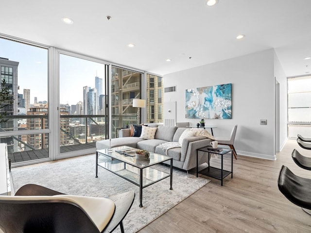 653 N Kingsbury St Unit 1707, Chicago, IL 60654 - living room with healthy amount of natural light, floor to ceiling windows, light wood-style flooring, recessed lighting, and a skyline view
