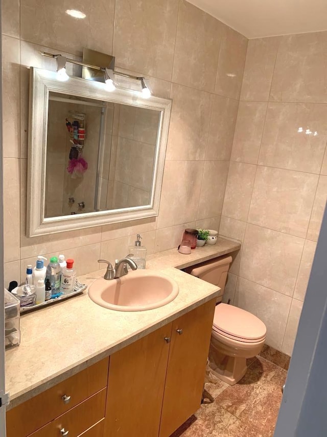 4250 N Marine Dr Unit 1404, Chicago, IL 60613 - bathroom with tile walls, vanity, and backsplash