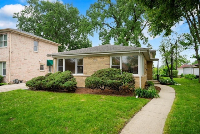 3935 W Jarvis Ave, Lincolnwood, IL 60712 - view of front of home featuring a front yard and brick siding