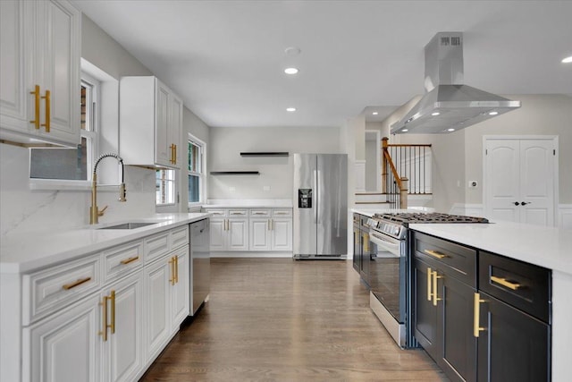 3935 W Jarvis Ave, Lincolnwood, IL 60712 - kitchen with stainless steel appliances, island exhaust hood, white cabinets, light countertops, and recessed lighting