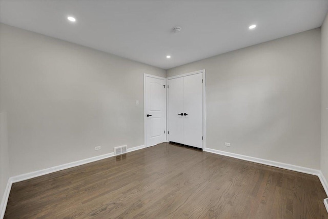 3935 W Jarvis Ave, Lincolnwood, IL 60712 - unfurnished room with dark wood-style flooring, recessed lighting, and a smoke detector