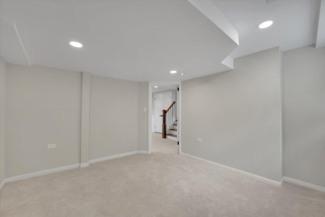 3935 W Jarvis Ave, Lincolnwood, IL 60712 - finished below grade area with light carpet, recessed lighting, and stairs