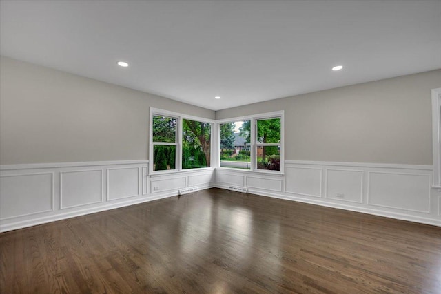 3935 W Jarvis Ave, Lincolnwood, IL 60712 - unfurnished room featuring a decorative wall, a wainscoted wall, recessed lighting, and wood finished floors