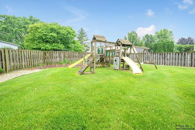 8246 N Applewood Ct, Hanover Park, IL 60133 - fenced backyard featuring a playground