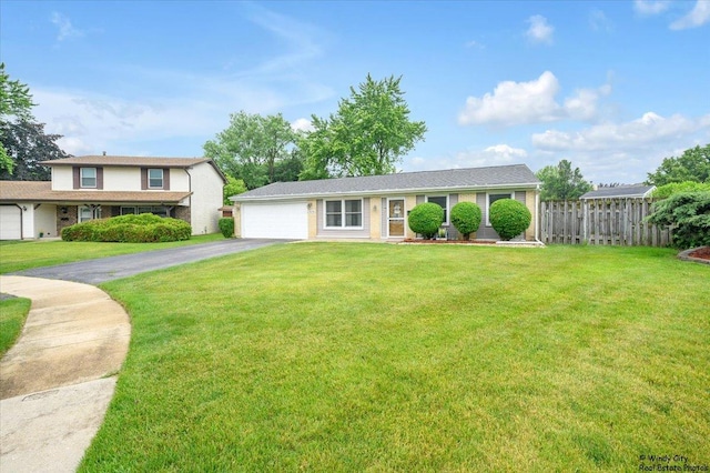 8246 N Applewood Ct, Hanover Park, IL 60133 - view of front of house featuring asphalt driveway and a garage