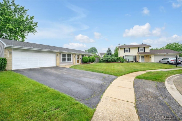 8246 N Applewood Ct, Hanover Park, IL 60133 - view of front of home with driveway, a front lawn, a garage, and brick siding