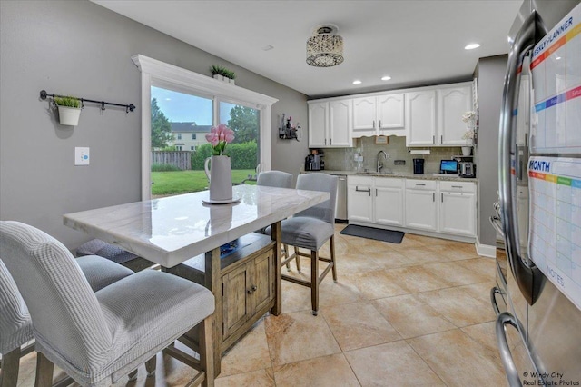 8246 N Applewood Ct, Hanover Park, IL 60133 - dining area featuring light tile patterned floors and recessed lighting