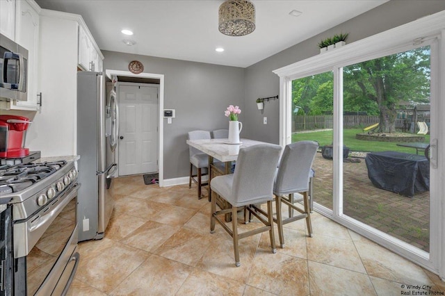 8246 N Applewood Ct, Hanover Park, IL 60133 - dining space featuring recessed lighting and light tile patterned floors
