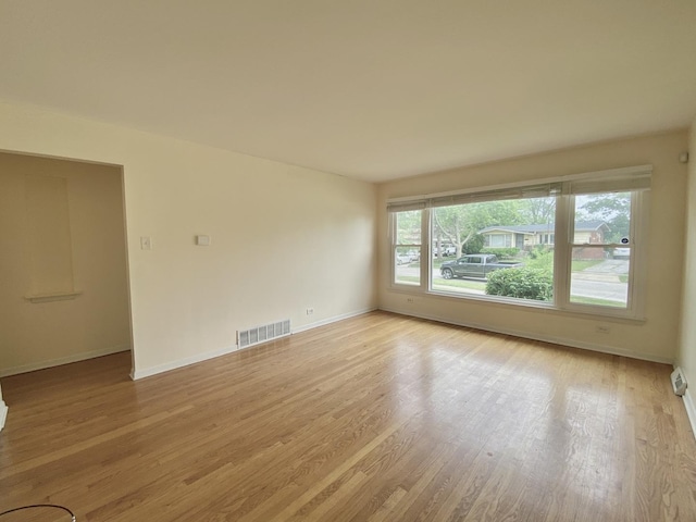 234 Tahoe Dr, Chicago Heights, IL 60411 - unfurnished room with baseboards and light wood-style floors