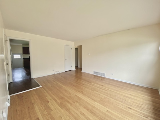 234 Tahoe Dr, Chicago Heights, IL 60411 - empty room with light wood-style flooring and baseboards