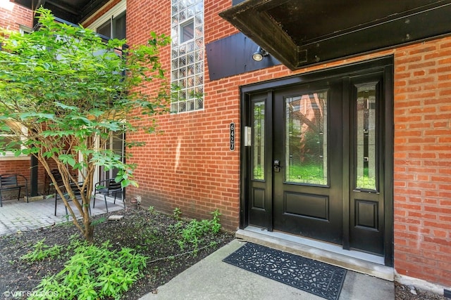 6427 N Damen Ave Unit 1E, Chicago, IL 60645 - property entrance featuring brick siding and french doors