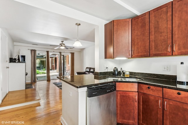 6427 N Damen Ave Unit 1E, Chicago, IL 60645 - kitchen with dishwasher, light wood-style flooring, dark stone countertops, a peninsula, and pendant lighting