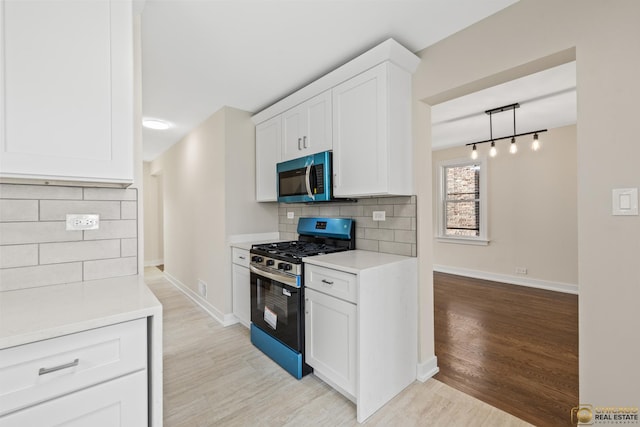 8207 S Laflin St, Chicago, IL 60620 - kitchen with stainless steel appliances, light wood finished floors, decorative backsplash, and light countertops