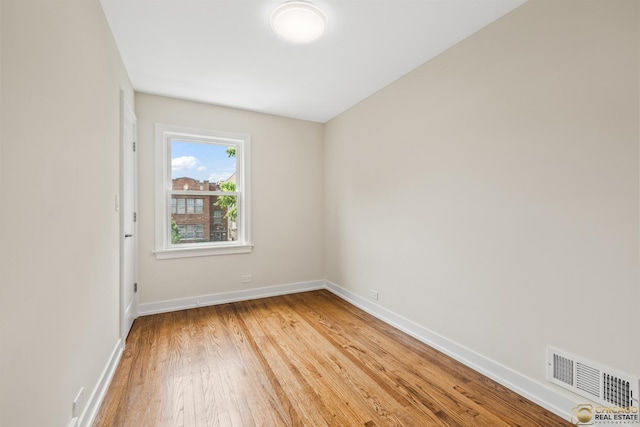 8207 S Laflin St, Chicago, IL 60620 - spare room with light wood finished floors and baseboards