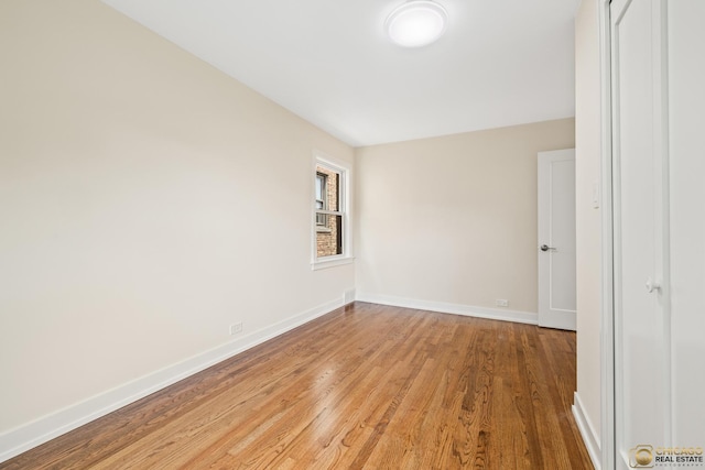 8207 S Laflin St, Chicago, IL 60620 - unfurnished room featuring wood finished floors and baseboards