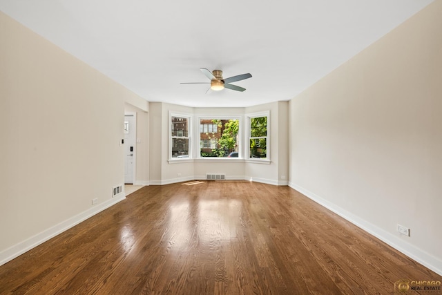 8207 S Laflin St, Chicago, IL 60620 - spare room with a ceiling fan and wood finished floors
