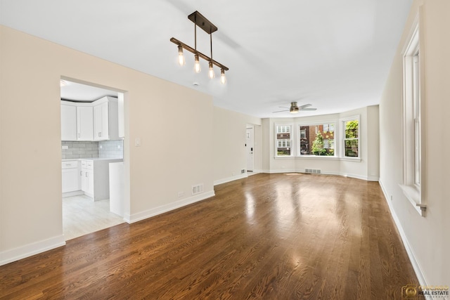 8207 S Laflin St, Chicago, IL 60620 - unfurnished living room with a ceiling fan and wood finished floors