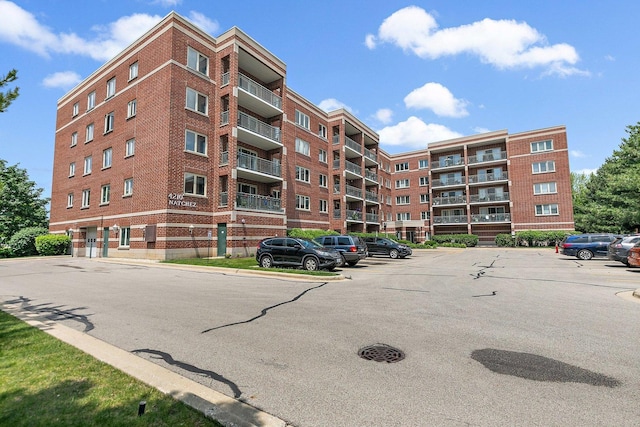 4210 N Natchez Ave Unit 208, Chicago, IL 60634 - view of apartment building / complex with uncovered parking