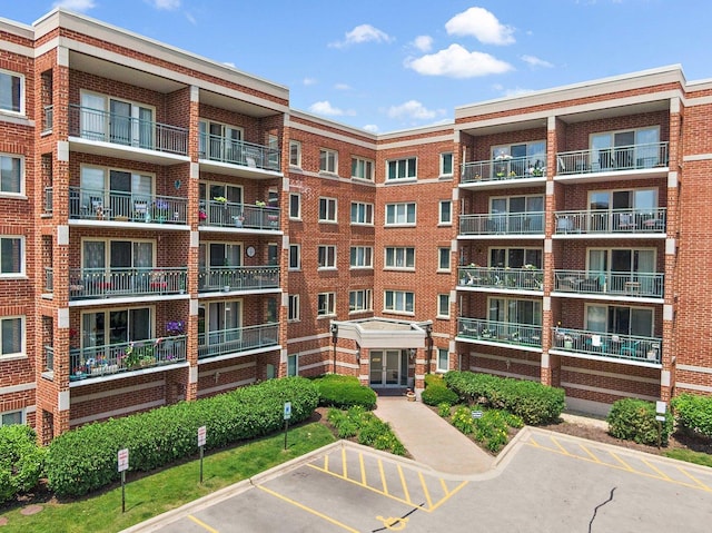 4210 N Natchez Ave Unit 208, Chicago, IL 60634 - view of apartment building / complex with uncovered parking