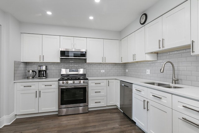 4210 N Natchez Ave Unit 208, Chicago, IL 60634 - kitchen featuring stainless steel appliances, light countertops, white cabinetry, and recessed lighting