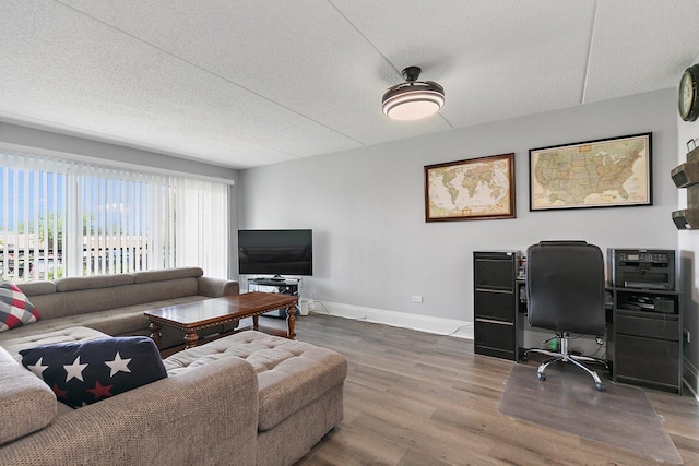 4210 N Natchez Ave Unit 208, Chicago, IL 60634 - living area featuring wood finished floors, a desk, and a textured ceiling