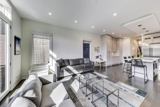 2131 W Huron St, Chicago, IL 60612 - living area featuring dark wood-style floors and recessed lighting