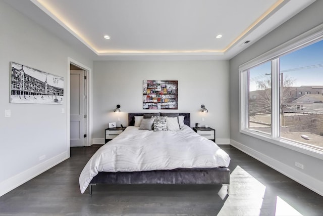 2131 W Huron St, Chicago, IL 60612 - bedroom featuring a tray ceiling, dark wood-type flooring, and recessed lighting