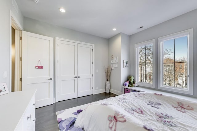 2131 W Huron St, Chicago, IL 60612 - bedroom with dark wood-style floors, a closet, and recessed lighting
