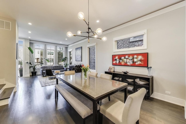 2131 W Huron St, Chicago, IL 60612 - dining area with a chandelier, dark wood finished floors, and recessed lighting