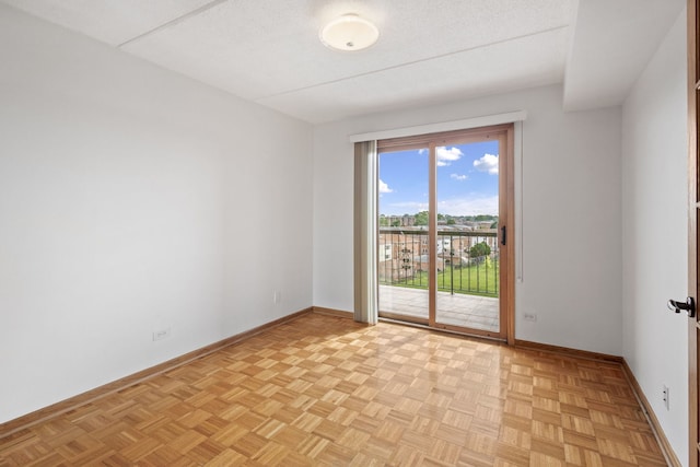 8540 W Foster Ave Unit 505, Norridge, IL 60706 - spare room with baseboards and a textured ceiling