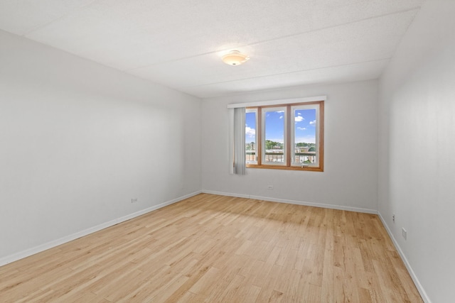 8540 W Foster Ave Unit 505, Norridge, IL 60706 - empty room featuring light wood-style floors and baseboards