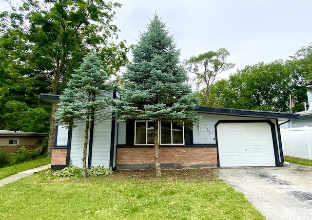456 Tomahawk St, Park Forest, IL 60466 - view of front of property featuring brick siding, a garage, and driveway