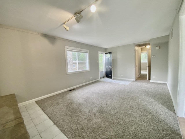 456 Tomahawk St, Park Forest, IL 60466 - empty room with track lighting, light carpet, and light tile patterned flooring