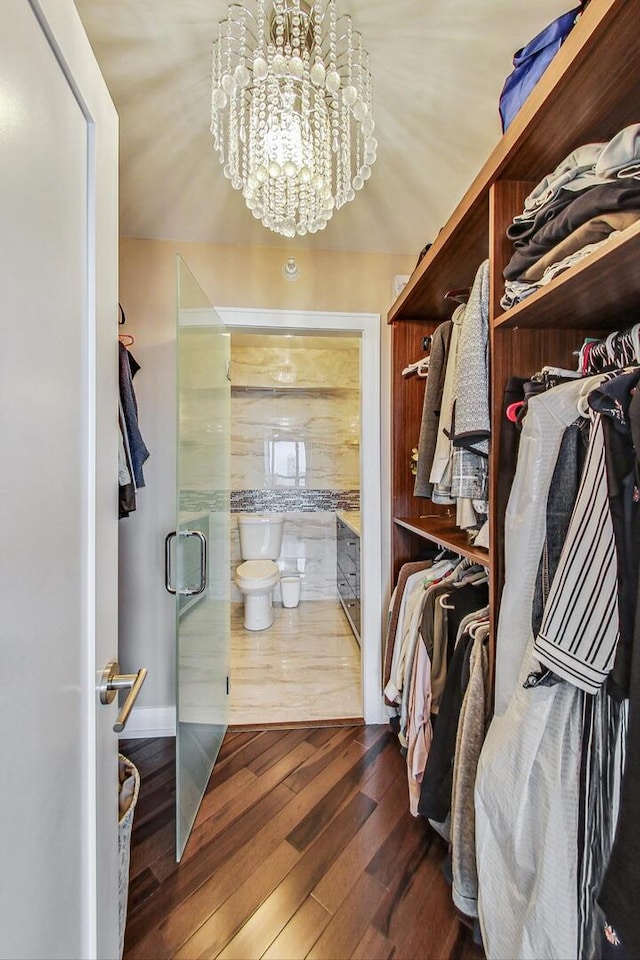 10 E Ontario St Unit 4808, Chicago, IL 60611 - walk in closet with hardwood / wood-style flooring and a chandelier