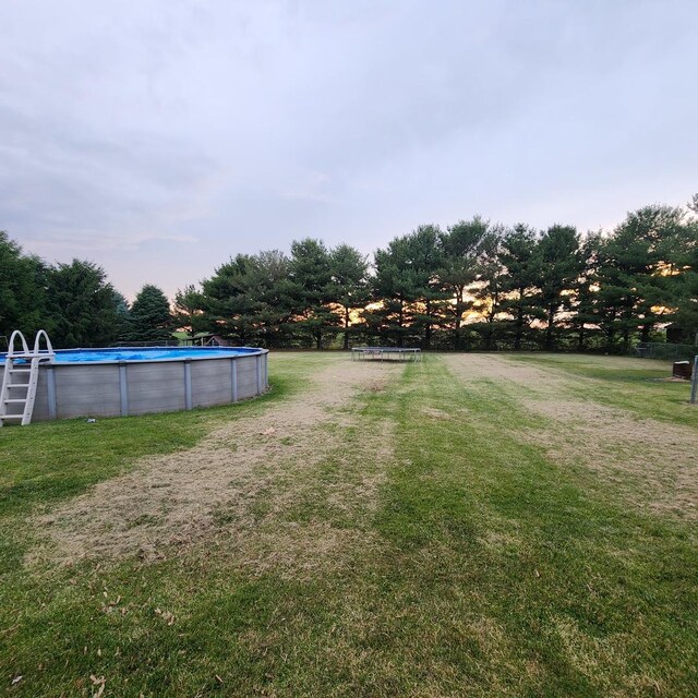 3883 E 2050th Rd, Serena, IL 60549 - view of grassy yard with an outdoor pool